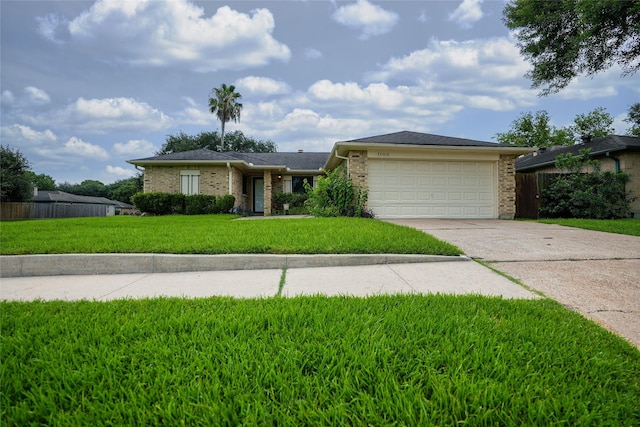 1103 W Brompton Dr, Pearland, TX 77584 - single story home featuring driveway, an attached garage, and brick siding