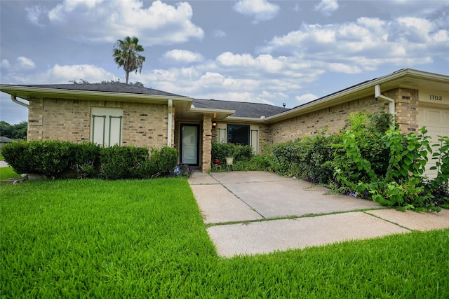 1103 W Brompton Dr, Pearland, TX 77584 - ranch-style house with a front lawn, brick siding, and a garage