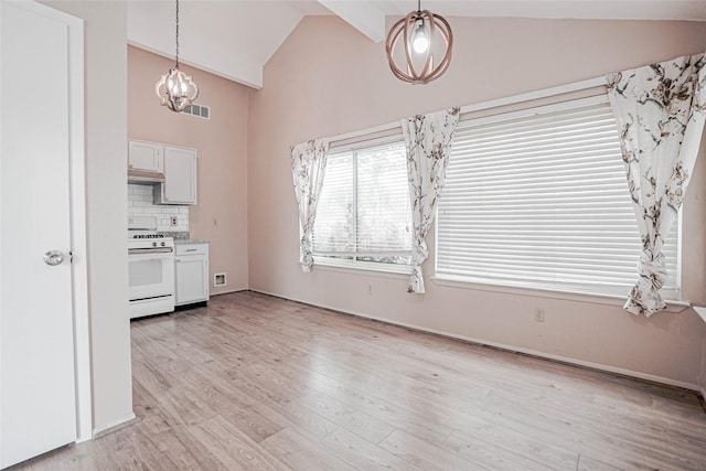 1103 W Brompton Dr, Pearland, TX 77584 - kitchen featuring gas range gas stove, a chandelier, decorative light fixtures, high vaulted ceiling, and light wood-type flooring