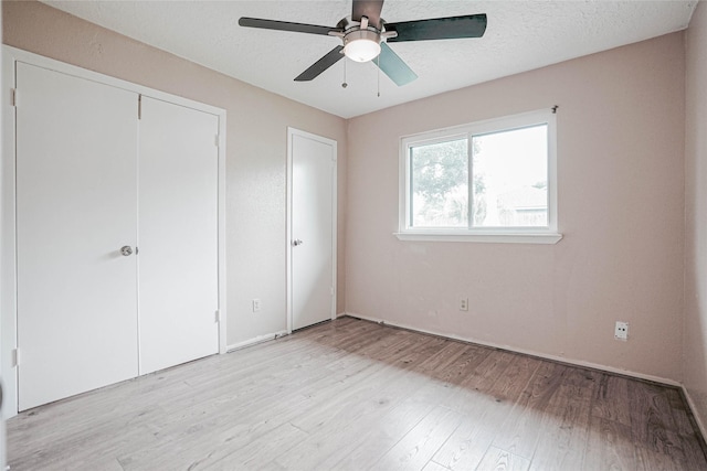 1103 W Brompton Dr, Pearland, TX 77584 - unfurnished bedroom with light wood-style flooring, a closet, and ceiling fan