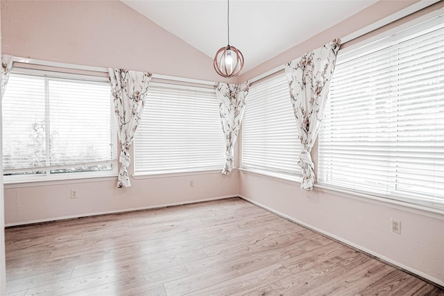 1103 W Brompton Dr, Pearland, TX 77584 - unfurnished dining area with lofted ceiling and wood finished floors