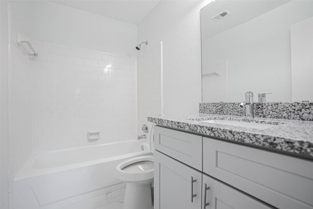 1103 W Brompton Dr, Pearland, TX 77584 - full bathroom with marble look tile flooring, vanity, and shower / tub combination