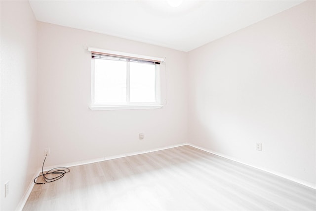 1103 W Brompton Dr, Pearland, TX 77584 - unfurnished room featuring wood finished floors and baseboards