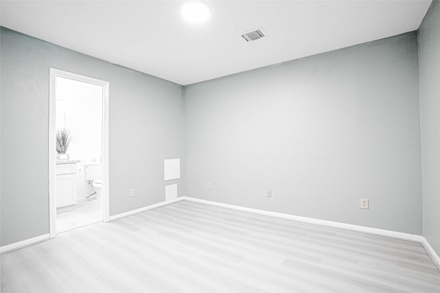 1103 W Brompton Dr, Pearland, TX 77584 - unfurnished bedroom with light wood-style floors and ensuite bath