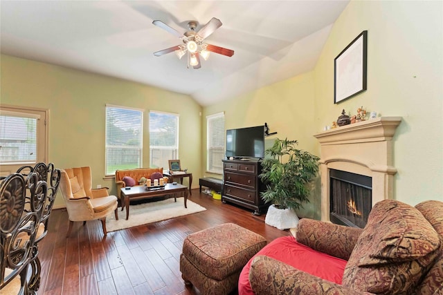 18843 Cove Pointe Dr, Cypress, TX 77433 - living room featuring ceiling fan, dark wood finished floors, a lit fireplace, and vaulted ceiling