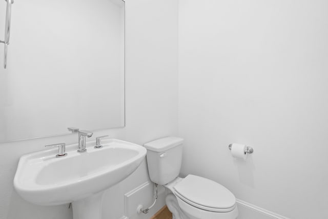 614 Delmar St, Houston, TX 77023 - half bath featuring a sink and toilet