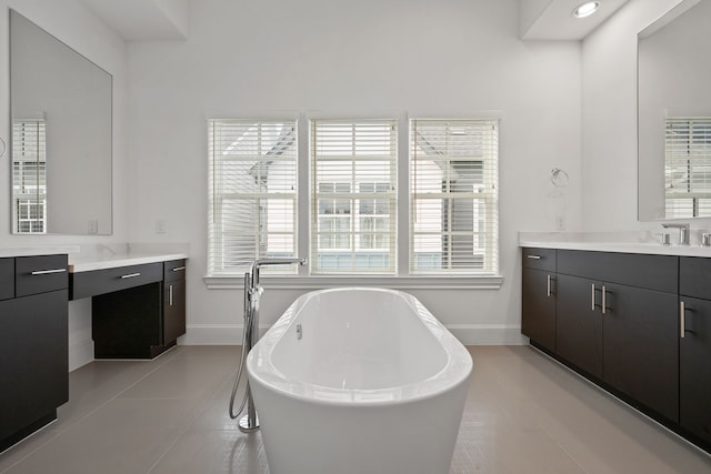 614 Delmar St, Houston, TX 77023 - full bath with a freestanding bath, vanity, and tile patterned floors