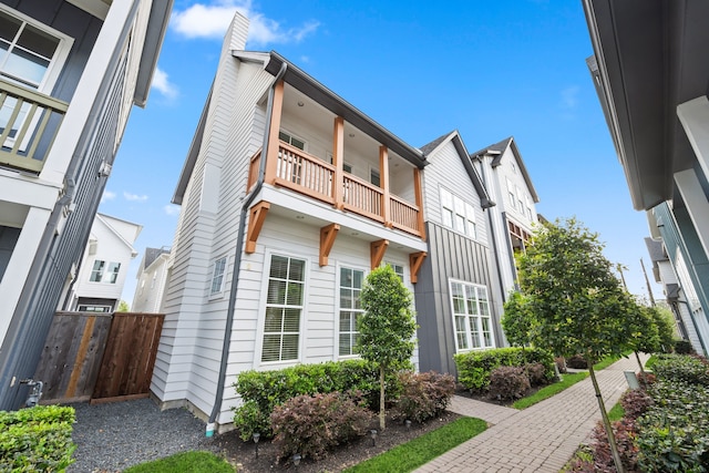 614 Delmar St, Houston, TX 77023 - view of home's exterior featuring a balcony and a chimney
