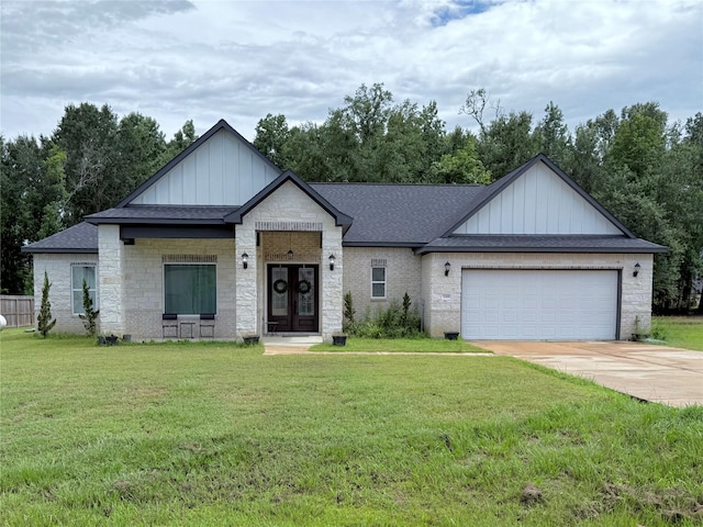 2069 Rd 660, Dayton, TX 77535 - view of front of property with board and batten siding, a front lawn, an attached garage, driveway, and roof with shingles