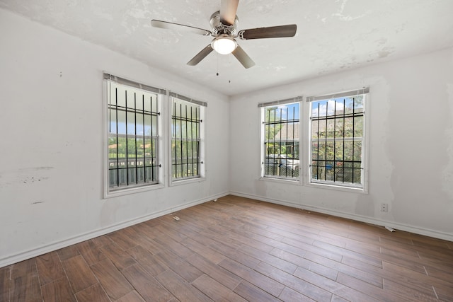 3822 Wipprecht St, Houston, TX 77026 - spare room featuring wood finished floors and a ceiling fan