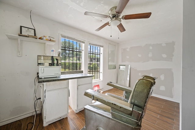 3822 Wipprecht St, Houston, TX 77026 - kitchen with wood finished floors, open shelves, ceiling fan, white cabinetry, and dark countertops