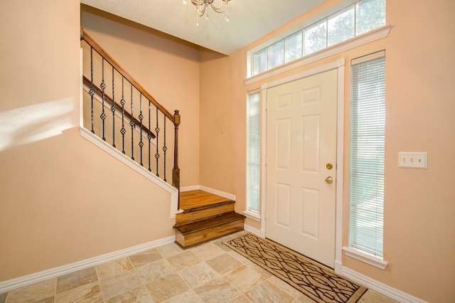 2917 Veva Dr, Pearland, TX 77584 - entrance foyer with stairway and a chandelier