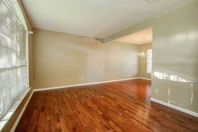 2917 Veva Dr, Pearland, TX 77584 - unfurnished room with a chandelier and wood finished floors