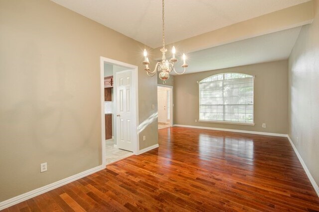 2917 Veva Dr, Pearland, TX 77584 - empty room with a chandelier and wood finished floors