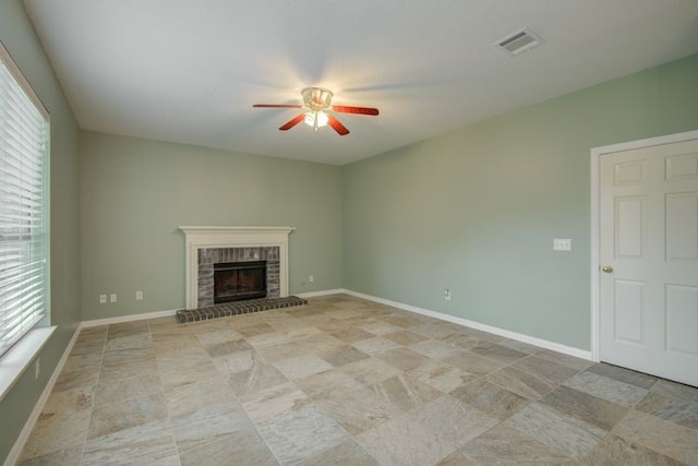 2917 Veva Dr, Pearland, TX 77584 - unfurnished living room featuring ceiling fan, a brick fireplace, and plenty of natural light