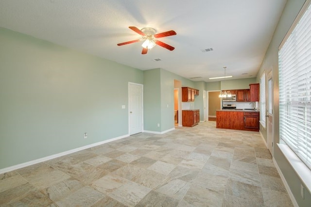 2917 Veva Dr, Pearland, TX 77584 - unfurnished living room featuring ceiling fan and baseboards