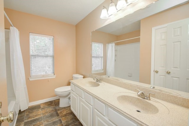 2917 Veva Dr, Pearland, TX 77584 - bathroom with double vanity, shower / tub combo, and stone finish floors