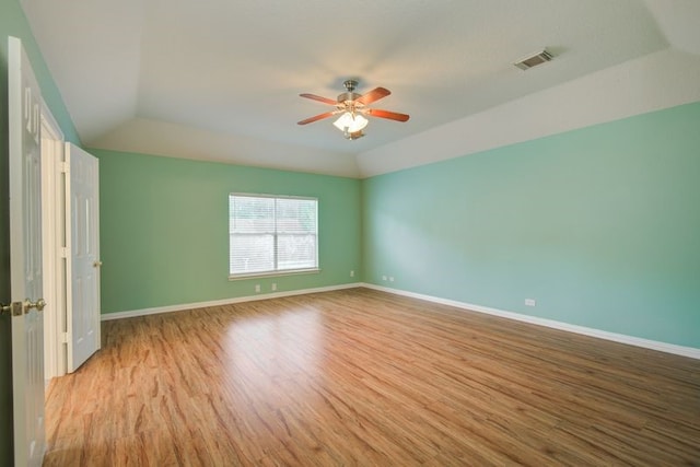 2917 Veva Dr, Pearland, TX 77584 - spare room with wood finished floors, ceiling fan, and vaulted ceiling