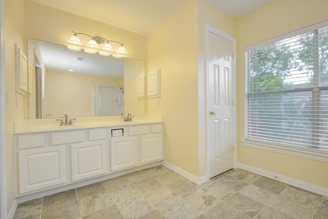 2917 Veva Dr, Pearland, TX 77584 - bathroom featuring double vanity and a shower with shower door