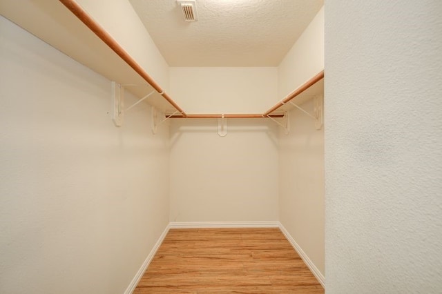 2917 Veva Dr, Pearland, TX 77584 - walk in closet with light wood-style floors