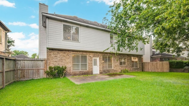 2917 Veva Dr, Pearland, TX 77584 - back of house featuring a chimney, a fenced backyard, brick siding, and a patio