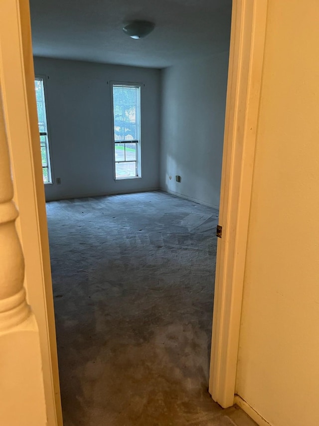 10317 Briar Forest Dr Unit 2/14, Houston, TX 77042 - empty room with plenty of natural light and dark colored carpet