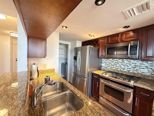 3525 Sage Rd Unit 1204, Houston, TX 77056 - kitchen featuring stainless steel appliances, light stone countertops, and tasteful backsplash