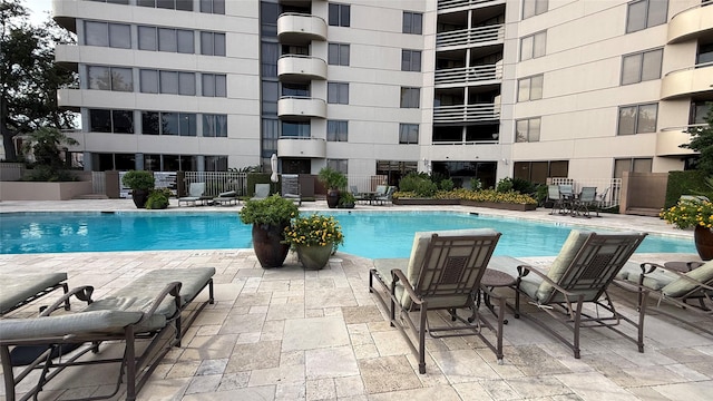 3525 Sage Rd Unit 1204, Houston, TX 77056 - community pool featuring a patio
