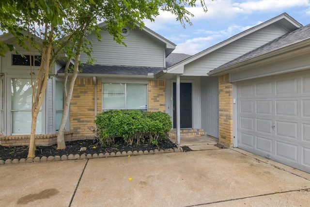 16822 Applecross Ln, Houston, TX 77084 - view of front of home with roof with shingles, brick siding, and an attached garage