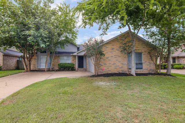 16822 Applecross Ln, Houston, TX 77084 - ranch-style house featuring concrete driveway, brick siding, a front yard, and an attached garage