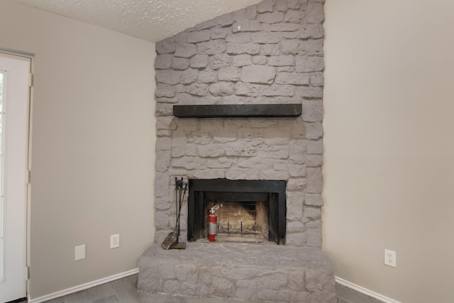 16822 Applecross Ln, Houston, TX 77084 - detailed view of a fireplace, wood finished floors, and a textured ceiling