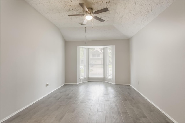 16822 Applecross Ln, Houston, TX 77084 - unfurnished room featuring a textured ceiling, ceiling fan, and wood finished floors