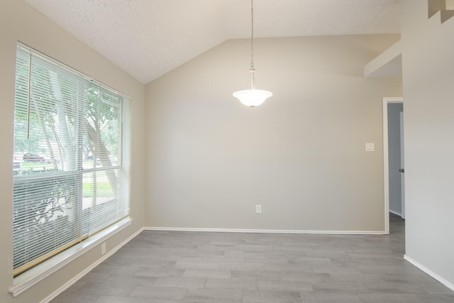 16822 Applecross Ln, Houston, TX 77084 - unfurnished room with wood finished floors, vaulted ceiling, and a textured ceiling