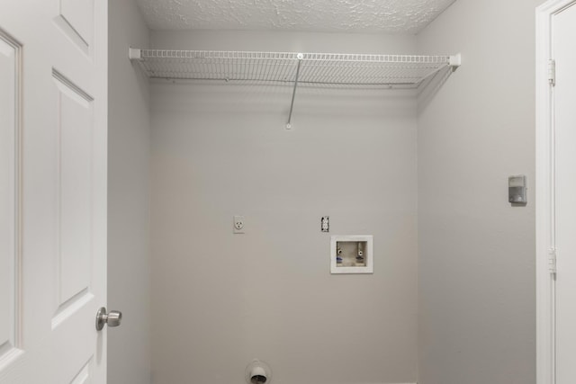 16822 Applecross Ln, Houston, TX 77084 - washroom featuring electric dryer hookup, hookup for a washing machine, and a textured ceiling