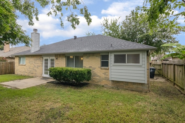 16822 Applecross Ln, Houston, TX 77084 - rear view of house featuring a fenced backyard, brick siding, and a chimney