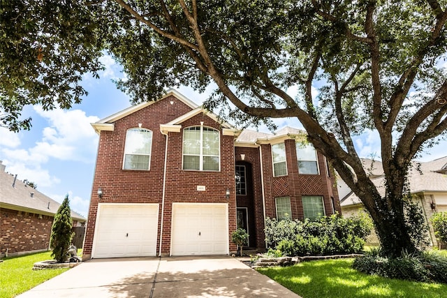 4919 Barstow Bend Ln, Katy, TX 77449 - traditional-style home featuring driveway, an attached garage, and brick siding
