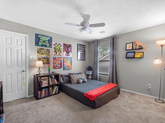 13923 Roanoke Falls Dr, Cypress, TX 77429 - carpeted bedroom with a textured ceiling and ceiling fan