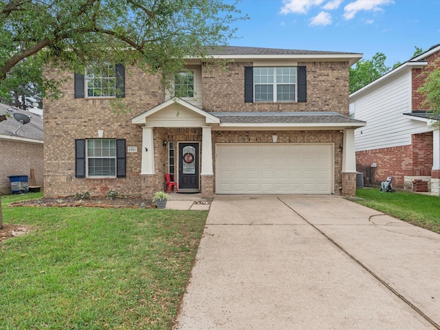 13923 Roanoke Falls Dr, Cypress, TX 77429 - view of front of home with driveway, a garage, a front lawn, and brick siding