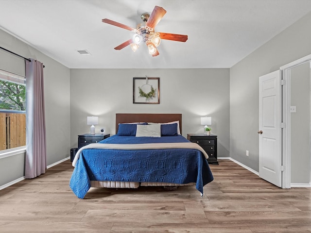 13923 Roanoke Falls Dr, Cypress, TX 77429 - bedroom featuring wood finished floors and a ceiling fan