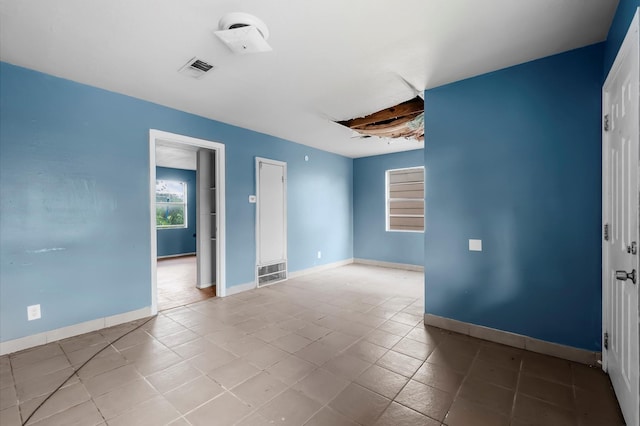 14504 Corpus Christi St Unit 4, Houston, TX 77015 - unfurnished room with tile patterned floors and baseboards