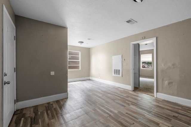 14504 Corpus Christi St Unit 4, Houston, TX 77015 - unfurnished room with wood finished floors and a textured ceiling