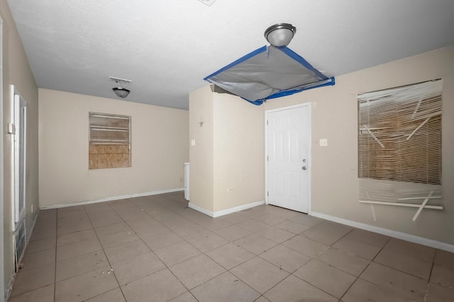 14504 Corpus Christi St Unit 4, Houston, TX 77015 - unfurnished room featuring tile patterned floors and baseboards