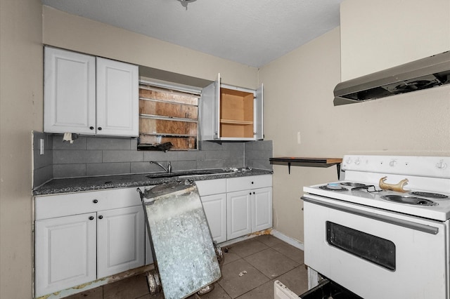 14504 Corpus Christi St Unit 4, Houston, TX 77015 - kitchen featuring white electric range oven, extractor fan, white cabinets, and tasteful backsplash