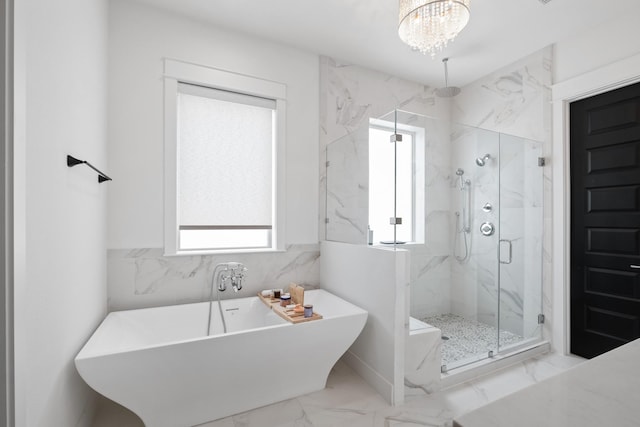 1405 Indiana St Unit B, Houston, TX 77006 - bathroom with a marble finish shower, a freestanding tub, marble finish floors, and a chandelier