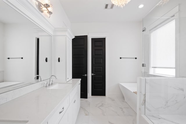 1405 Indiana St Unit B, Houston, TX 77006 - bathroom featuring a freestanding tub, vanity, marble finish flooring, recessed lighting, and a marble finish shower