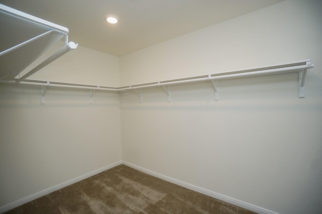 4615 Sabine Creek Way, Katy, TX 77449 - walk in closet featuring dark colored carpet