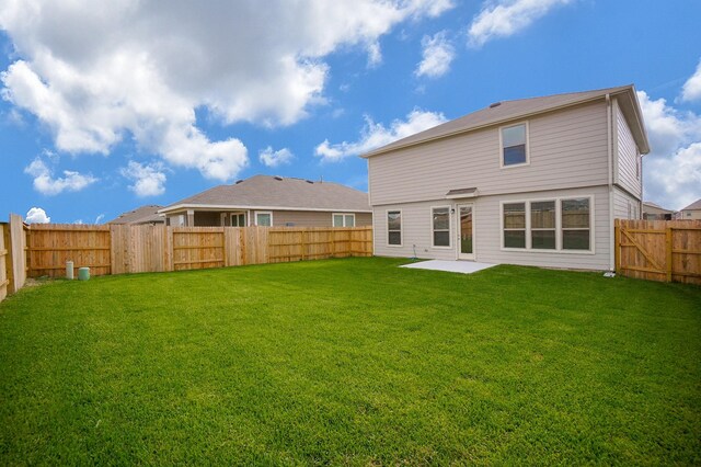 4615 Sabine Creek Way, Katy, TX 77449 - back of house featuring a fenced backyard and a patio area
