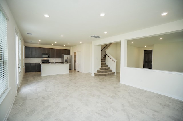 4615 Sabine Creek Way, Katy, TX 77449 - unfurnished living room with recessed lighting and stairs