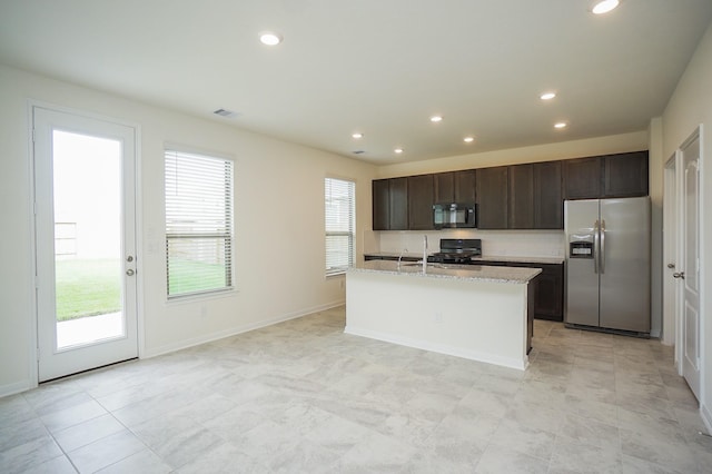 4615 Sabine Creek Way, Katy, TX 77449 - kitchen featuring stainless steel fridge with ice dispenser, black microwave, stove, recessed lighting, and dark brown cabinetry