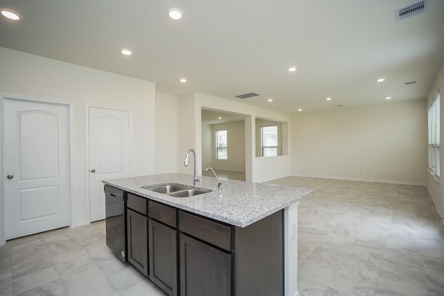 4615 Sabine Creek Way, Katy, TX 77449 - kitchen featuring black dishwasher, a center island with sink, light stone counters, recessed lighting, and dark brown cabinetry
